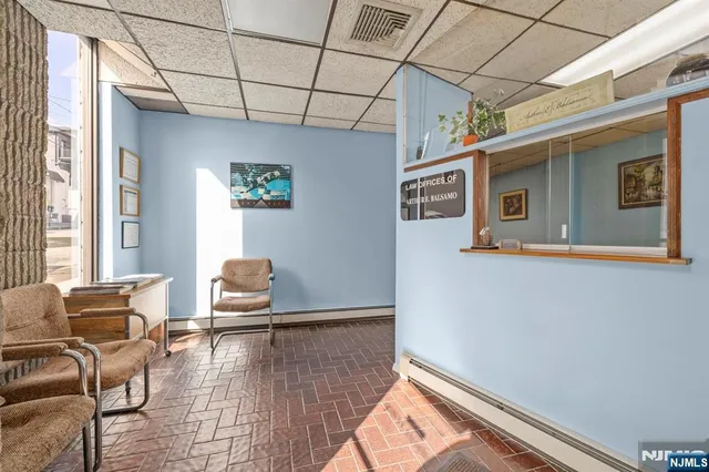 a view of a chairs in wooden floor