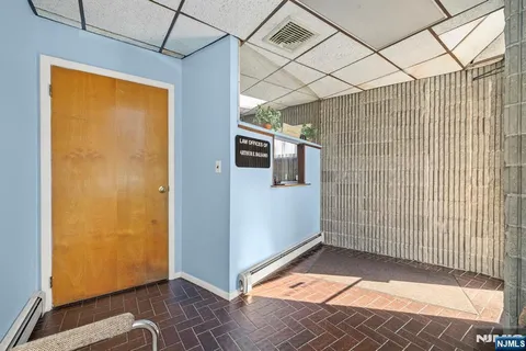 a room with furniture a washer and dryer