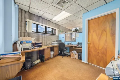 a view of living room with furniture and window