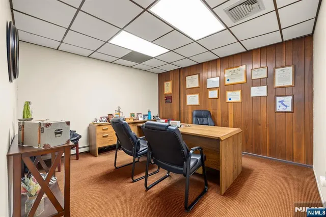 a view of a workspace with furniture