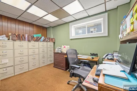 a bathroom with a sink toilet and a mirror