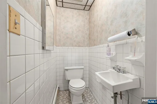 a dining room with furniture and a book shelf