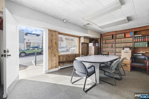 a balcony with a table and chairs