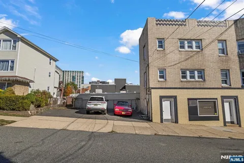 an aerial view of a building with street