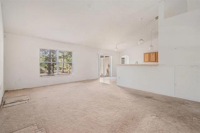 a large kitchen with cabinets and a counter top space