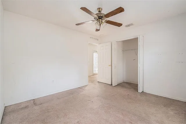 a view of a house with snow on the road