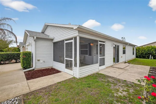 a view of a house with backyard