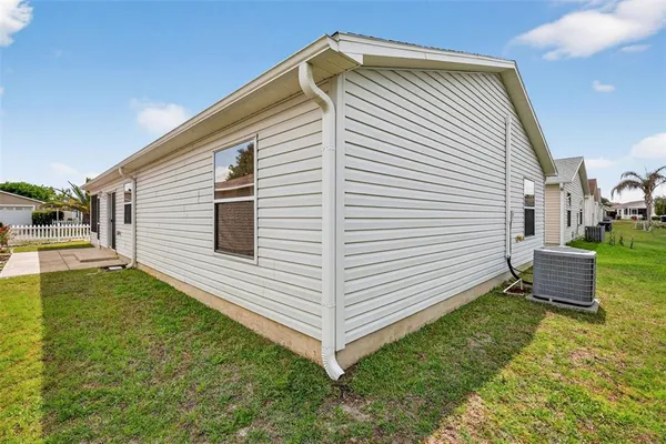 a view of a backyard with sitting area