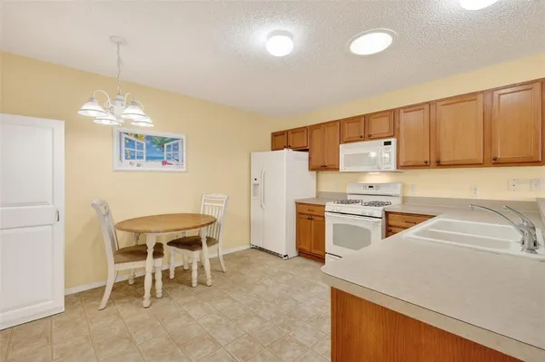 a kitchen with a sink cabinets and counter space