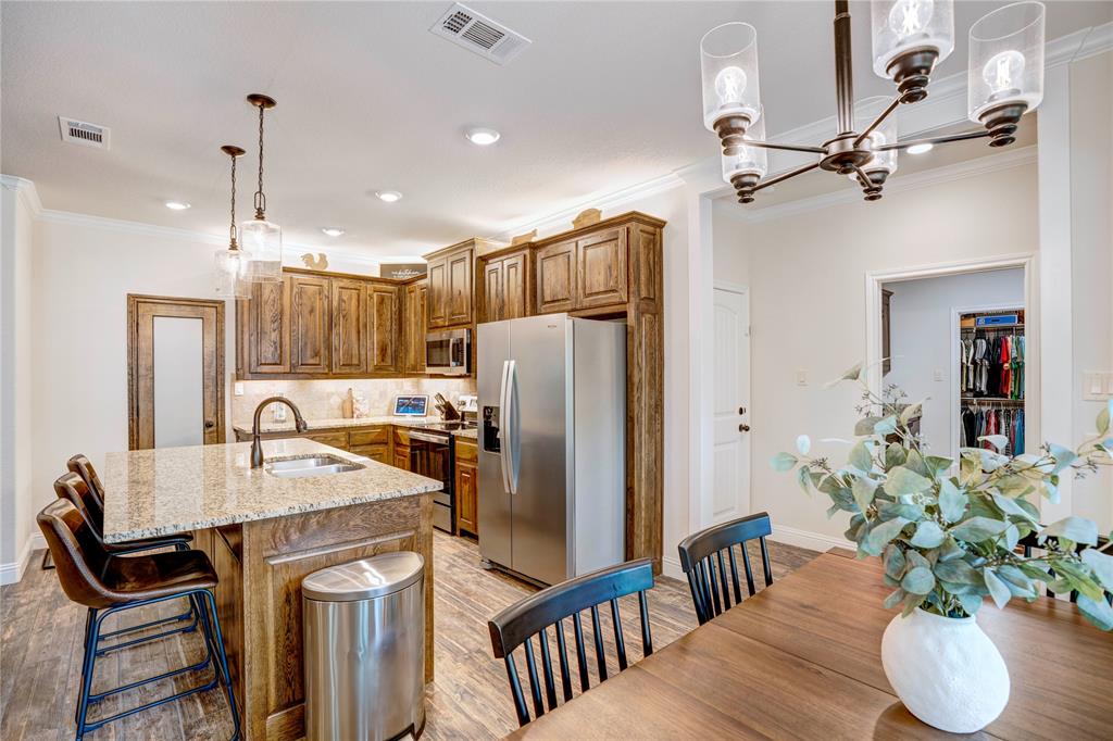 1355 Jay Bird Road Springtown, TX 76082 - Photo 16 of 40 a kitchen with refrigerator and countertop