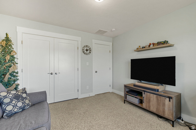18573 South Marsh Valley Road Downey, ID 83234 - Photo 17 of 32 Living room featuring baseboards and light colored carpet