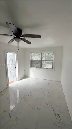 a bathroom with a toilet sink and shower