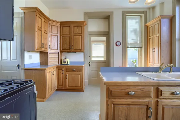 a bathroom with a sink a mirror and a shower