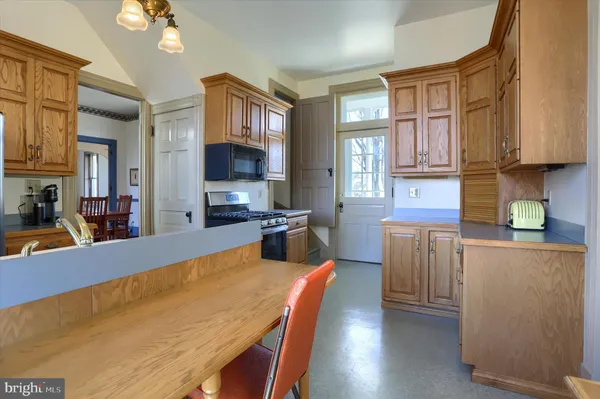 a utility room with cabinets washer and dryer