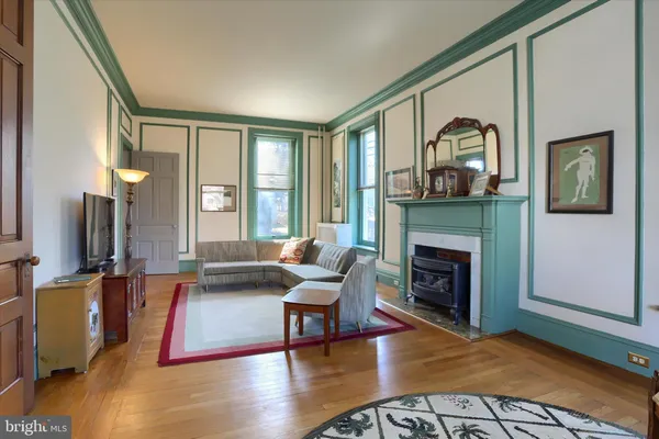 a bedroom with two beds and a window