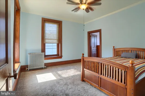 a bathroom with a double vanity sink mirror and toilet