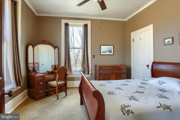 a bathroom with a sink toilet and a mirror