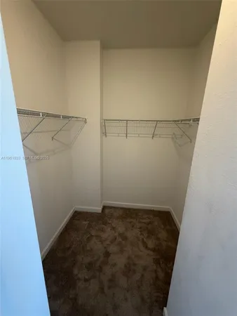 a bathroom with a sink tub and mirror