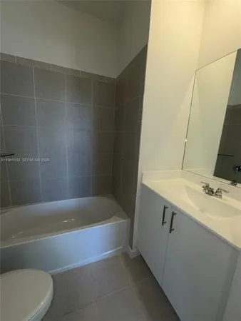 an empty room with a empty space and window