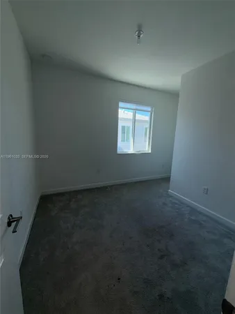 a bathroom with a shower sink vanity and toilet