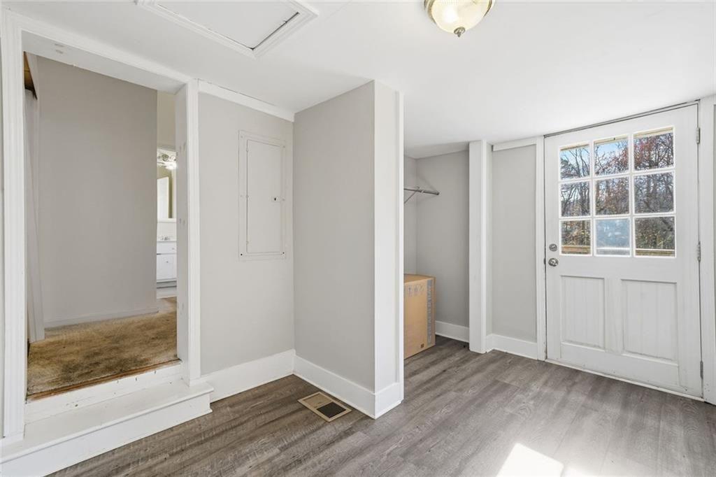 174 Cherokee Avenue Nelson, GA 30151 - Photo 11 of 28 wooden floor in an empty room with a window