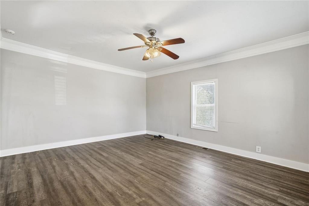174 Cherokee Avenue Nelson, GA 30151 - Photo 21 of 28 wooden floor in an empty room with a window