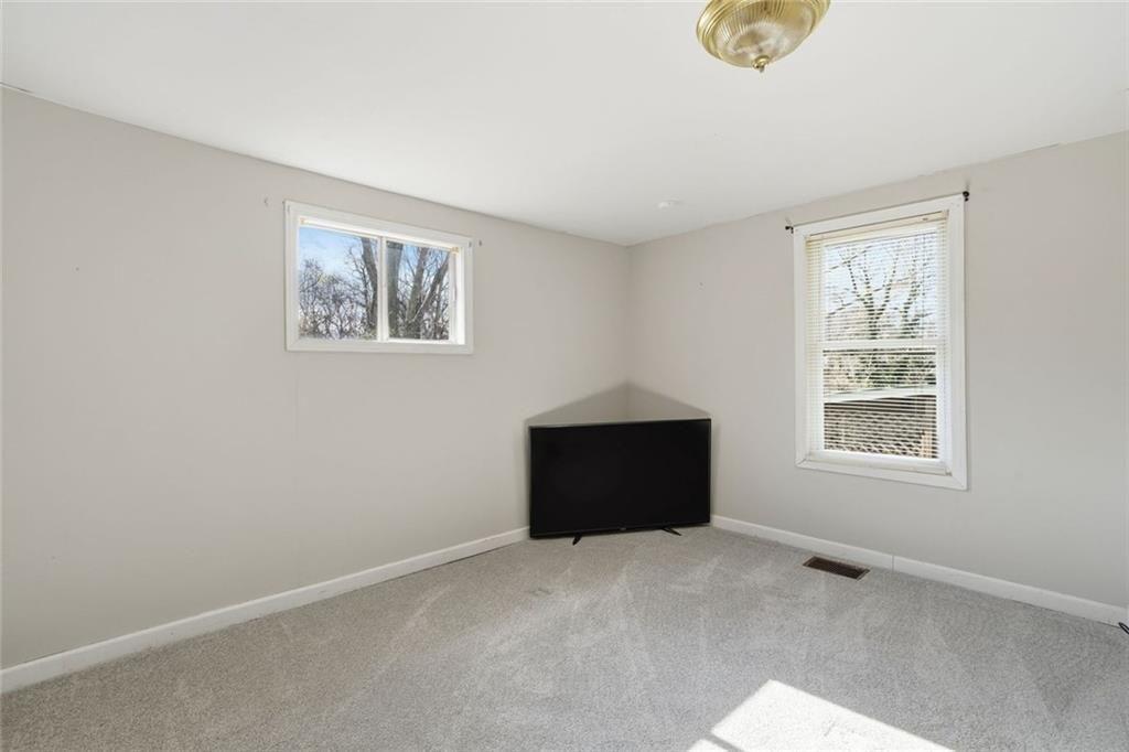 174 Cherokee Avenue Nelson, GA 30151 - Photo 22 of 28 an empty room with windows and closet