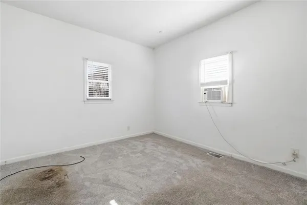an empty room with closet area