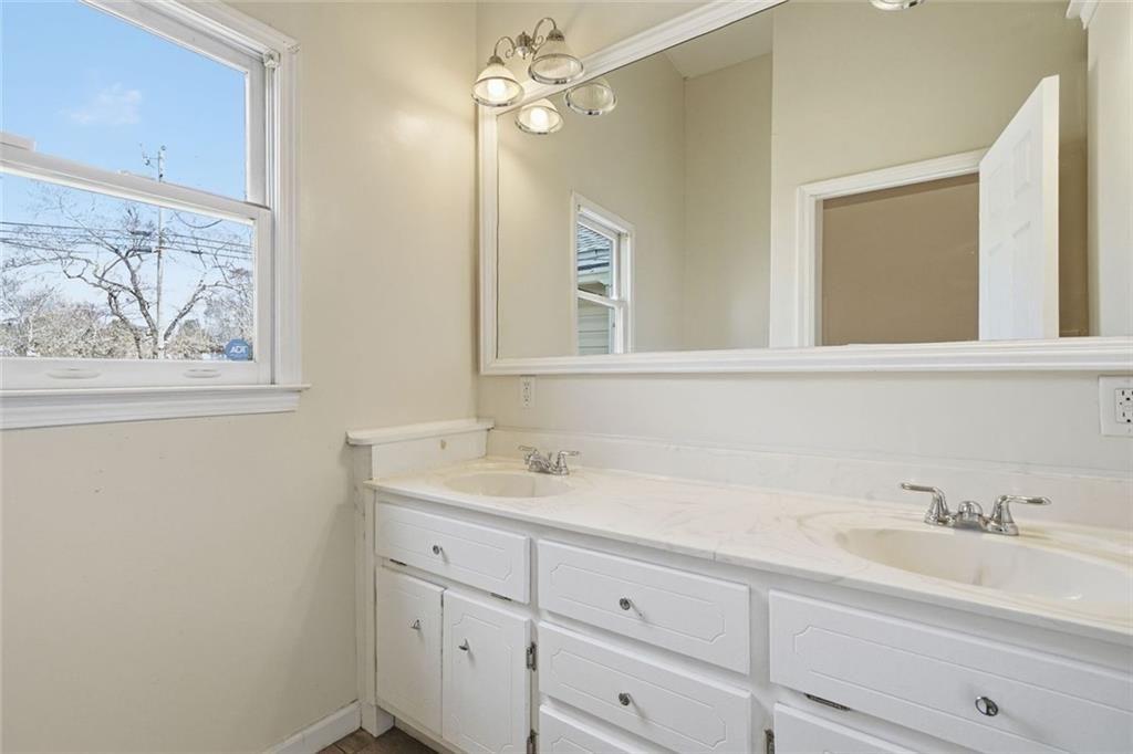 174 Cherokee Avenue Nelson, GA 30151 - Photo 26 of 28 a bathroom with a sink and a mirror