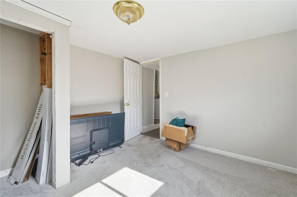 174 Cherokee Avenue Nelson, GA 30151 - Photo 27 of 28 a room with a chair and gym equipment