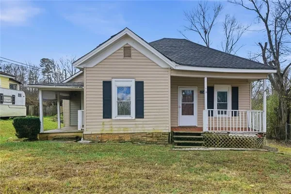 a front view of a house with a yard