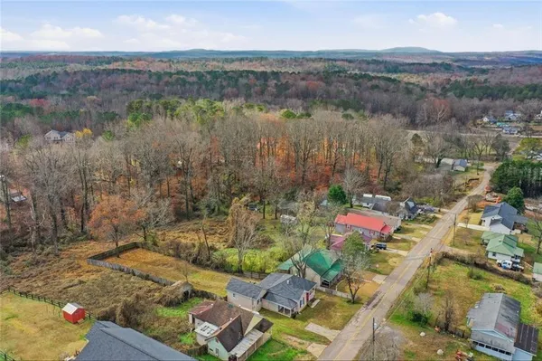 an aerial view of residential house with outdoor space and lake view