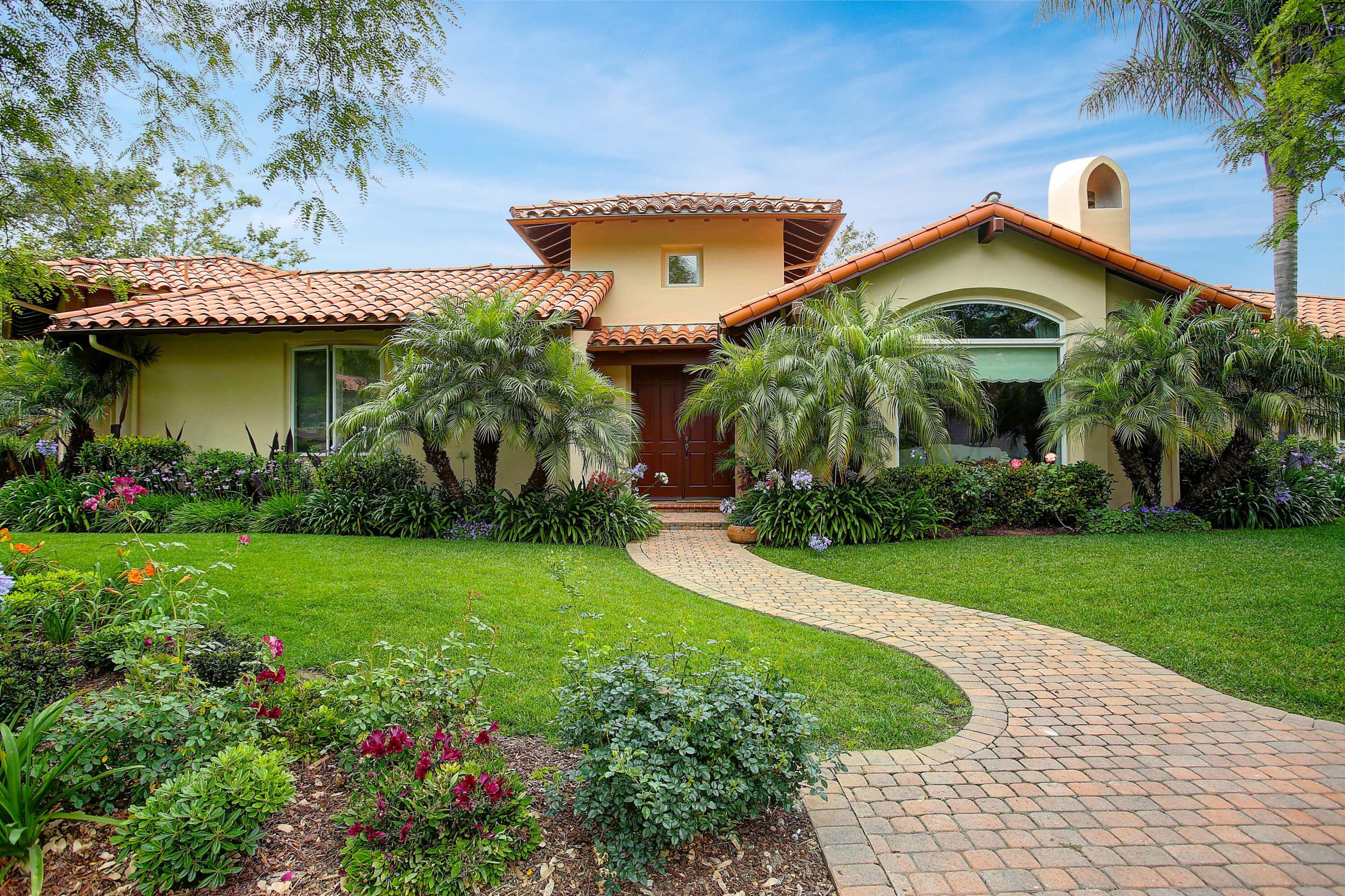 a view of a house with a garden