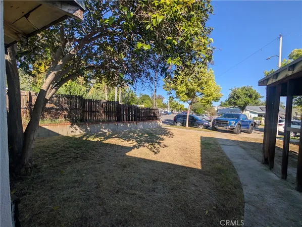 a view of a yard with patio