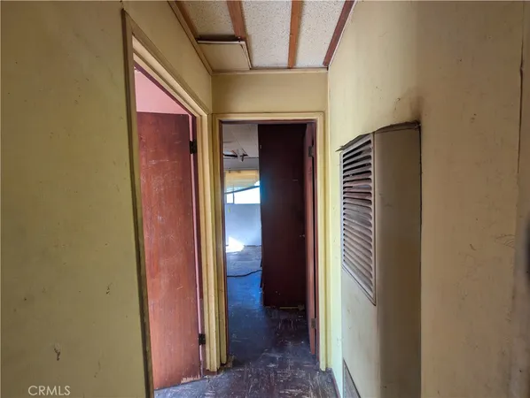 a view of hallway with wooden floor