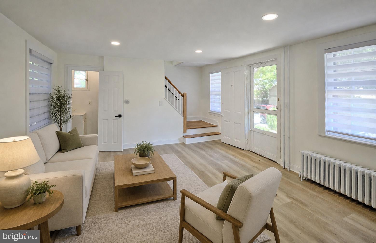 a living room with furniture and a table