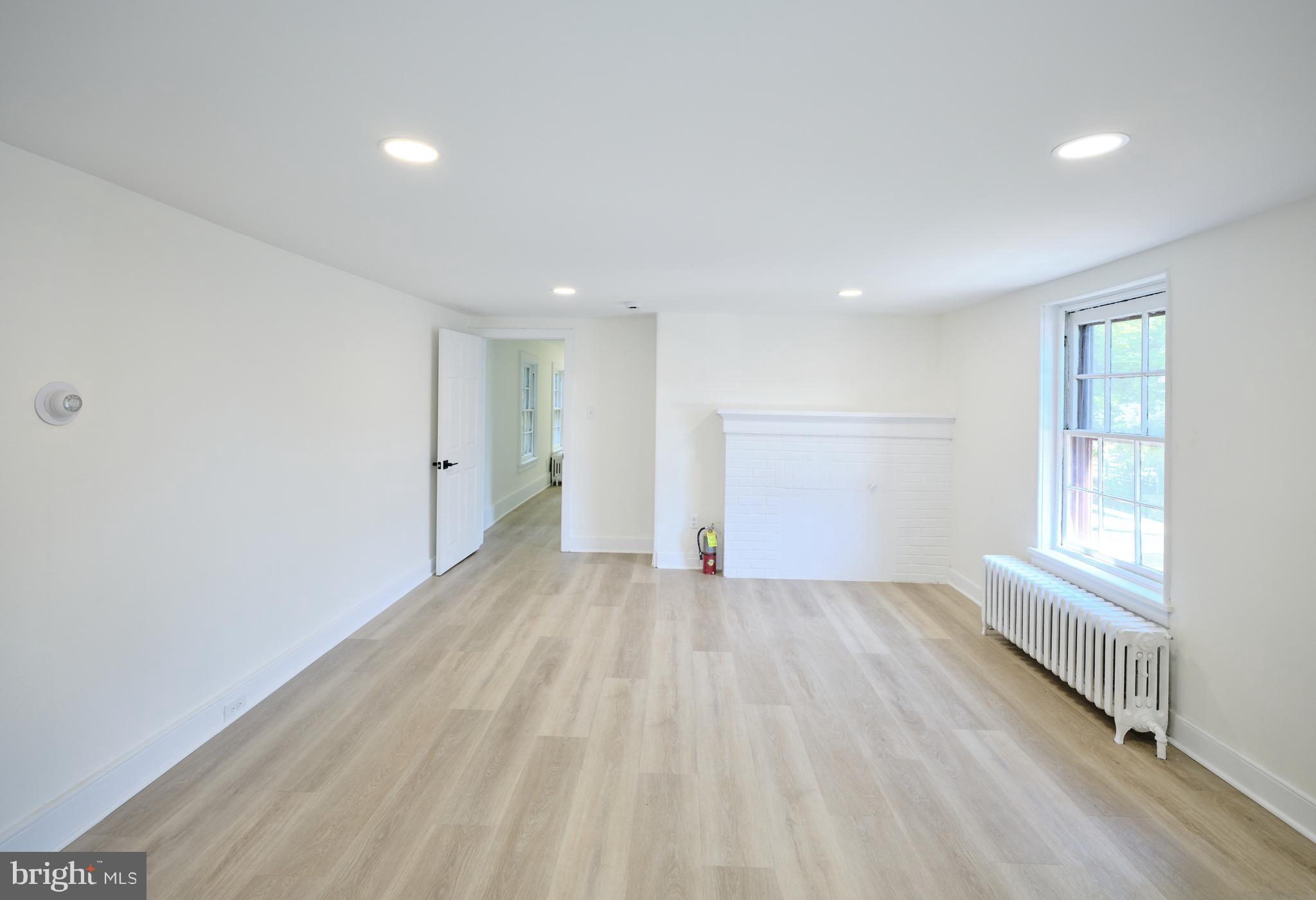 14 West Bridge Street, Unit A New Hope, PA 18938 - Photo 14 of 20 wooden floor in an empty room with a window