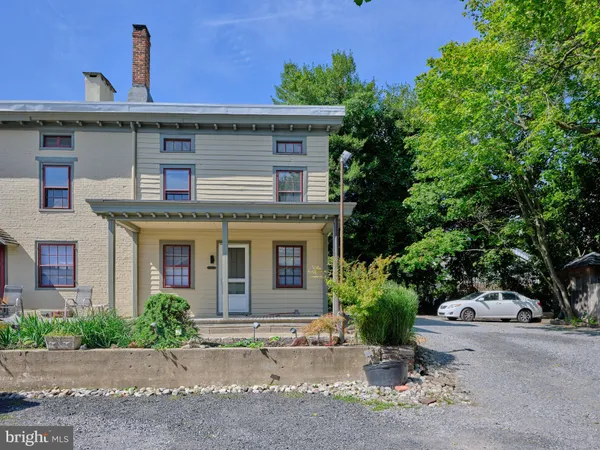 a front view of a house with yard