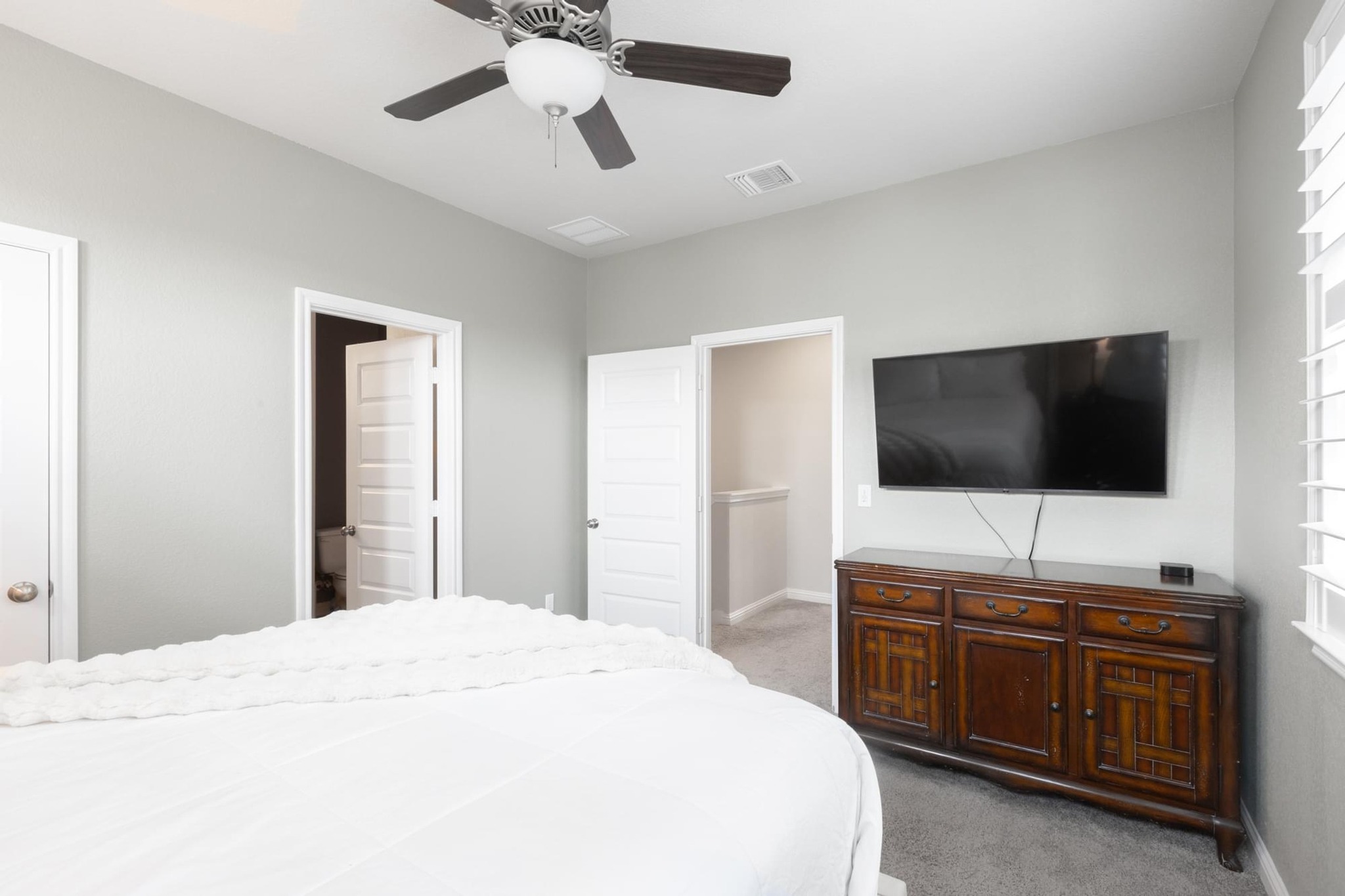 7801 Frida Bend Austin, TX 78744 - Photo 14 of 26 Well-lit bedroom with modern design, providing comfortable living spaces and privacy.