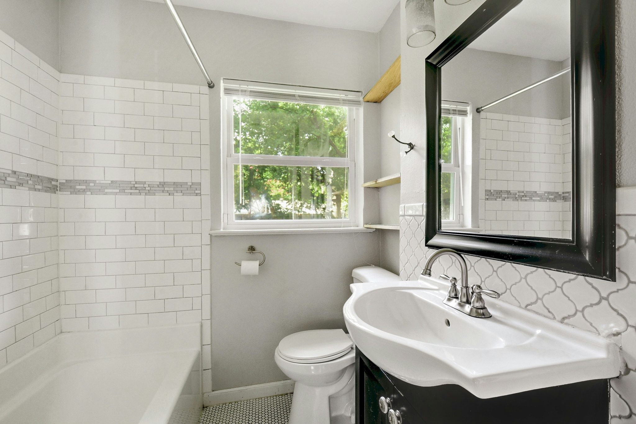 907 East 56th Street Austin, TX 78751 - Photo 15 of 20 a bathroom with a sink toilet and shower