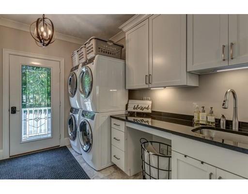 351 East Monomonac Road Rindge, NH 03461 - Photo 13 of 25 a kitchen with stainless steel appliances granite countertop a stove a sink and a white cabinets with wooden floor