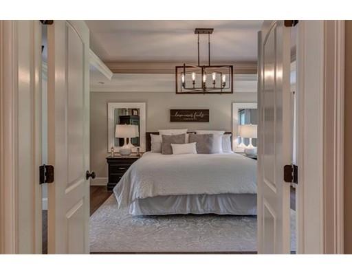 351 East Monomonac Road Rindge, NH 03461 - Photo 14 of 25 a bedroom with a bed and chandelier