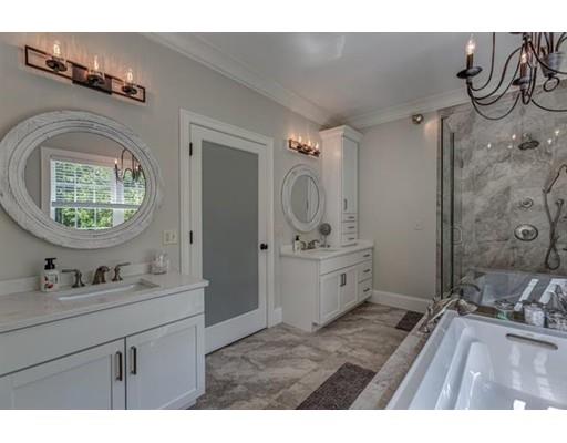 351 East Monomonac Road Rindge, NH 03461 - Photo 16 of 25 a bathroom with a sink a mirror and a vanity