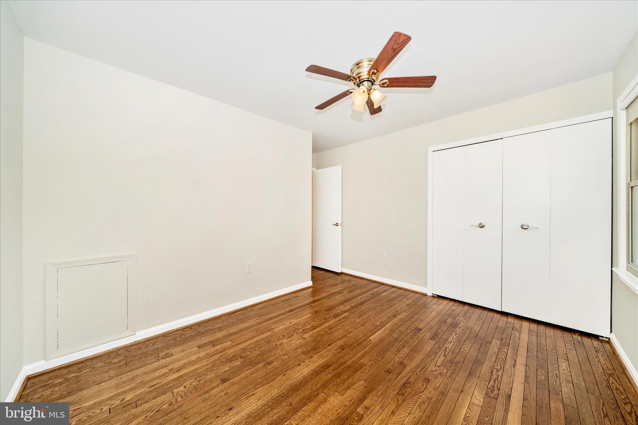 16000 Narrows Terrace Silver Spring, MD 20906 - Photo 29 of 54 a view of a room with wooden floor closet and windows