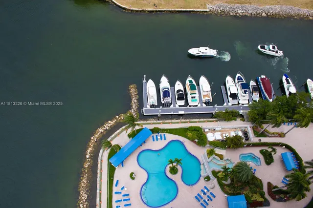 an aerial view of a swimming pool patio fire pit and outdoor seating