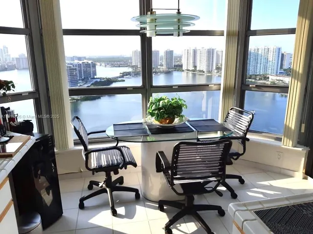a view of workspace with wooden floor and windows