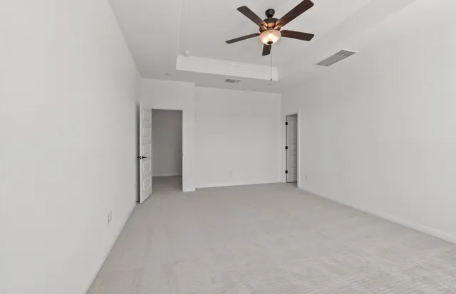a spacious bathroom with a shower a sink and a mirror