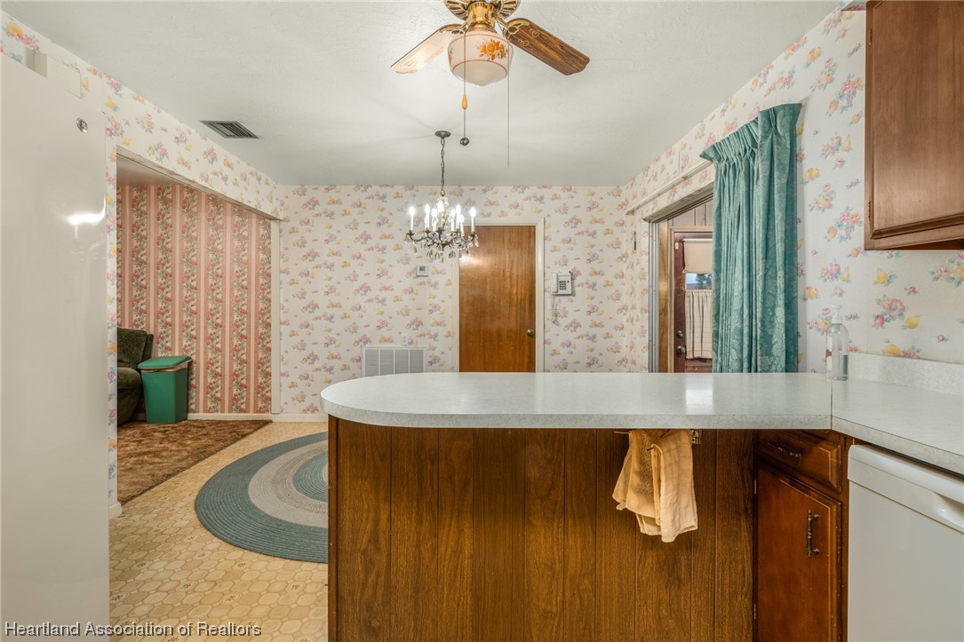 1221 Forest Road Sebring, FL 33872 - Photo 14 of 31 a bathroom with a granite countertop sink a large mirror and shower