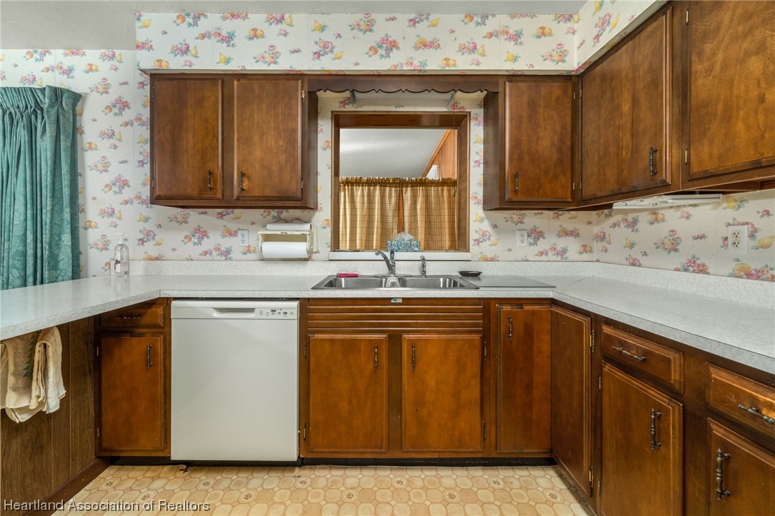 1221 Forest Road Sebring, FL 33872 - Photo 17 of 31 a kitchen with stainless steel appliances granite countertop a sink stove and cabinets