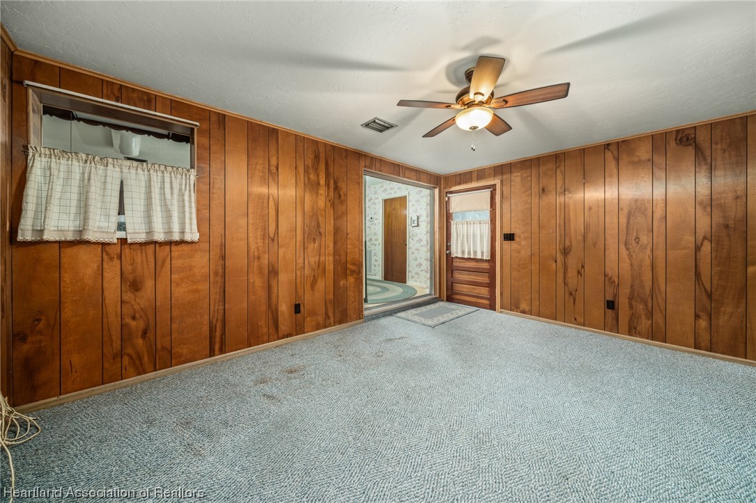 1221 Forest Road Sebring, FL 33872 - Photo 19 of 31 a view of an empty room with a ceiling fan